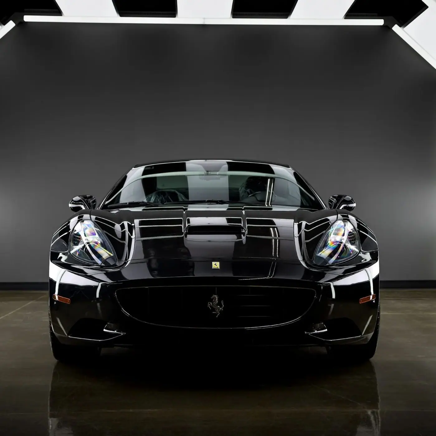 Front of a black Ferrari after paint correction and ceramic coating in Melbourne