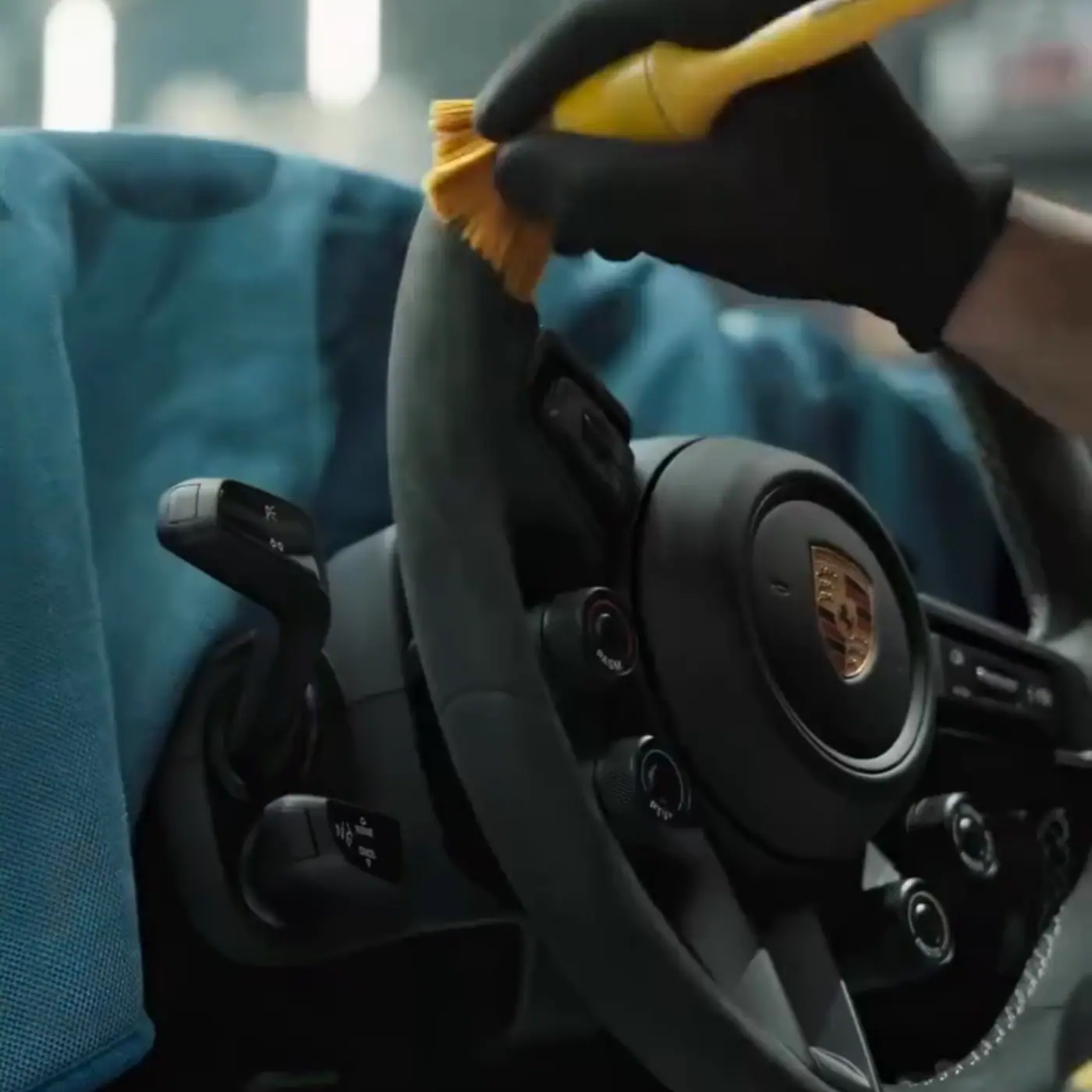Porsche steering wheel and cabin controls detailed by hand